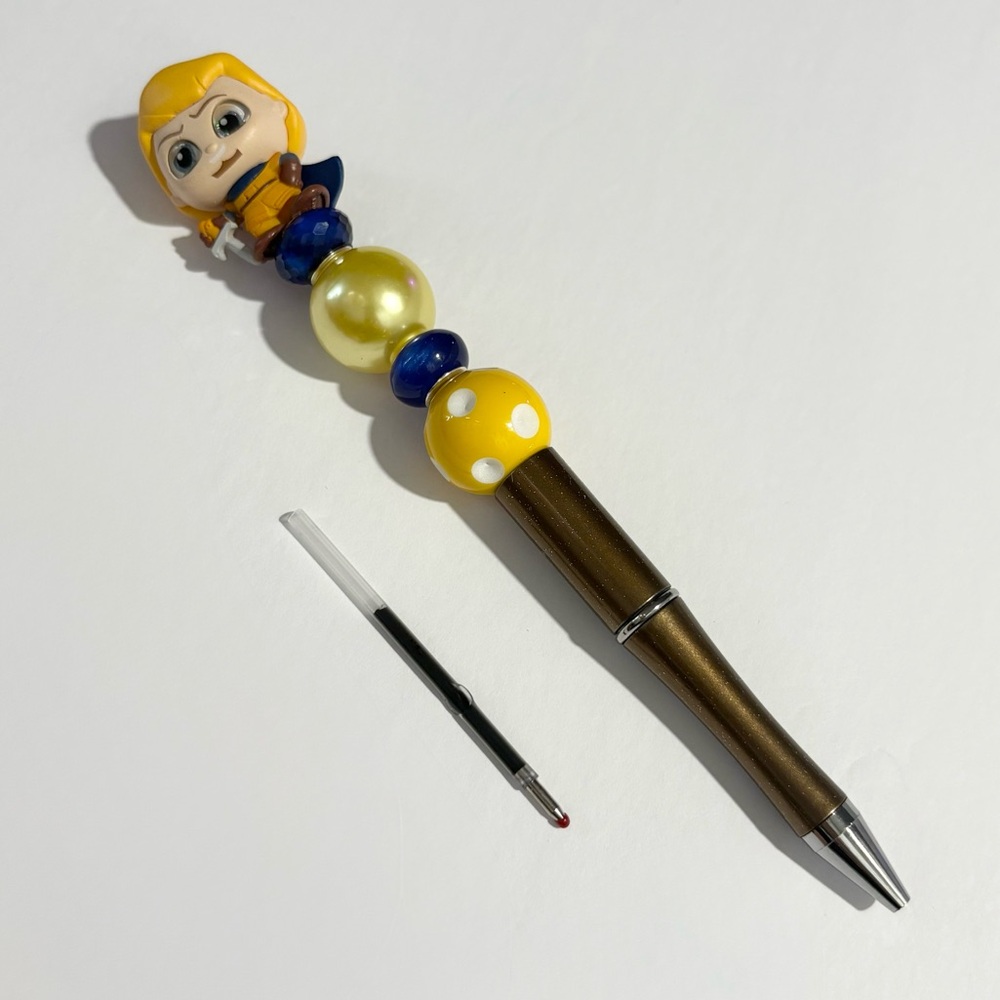Character-Themed Pen with Yellow and Blue Accents
